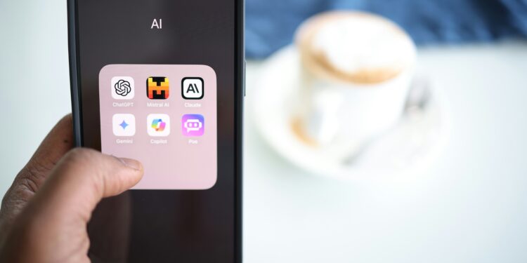 a person holding a cell phone in their hand